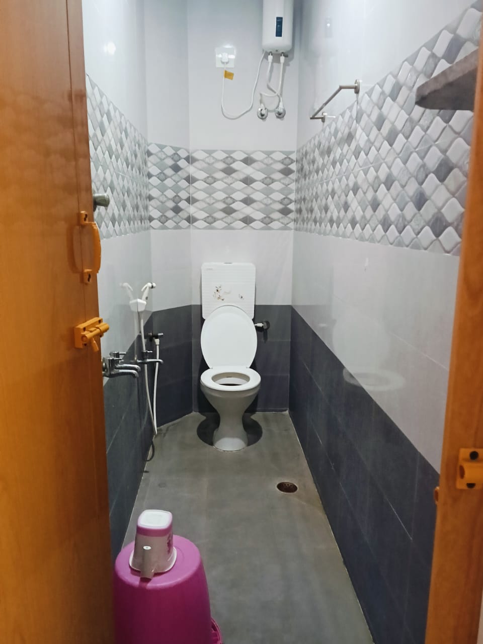 Modern western restroom with electric water geyser