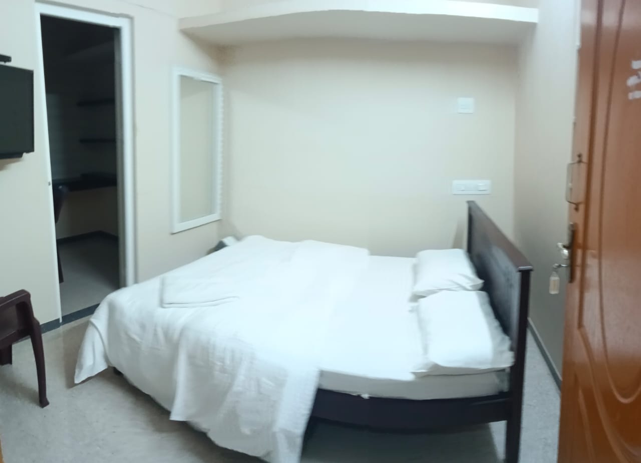 Master bedroom with dressing mirror and ambient lighting