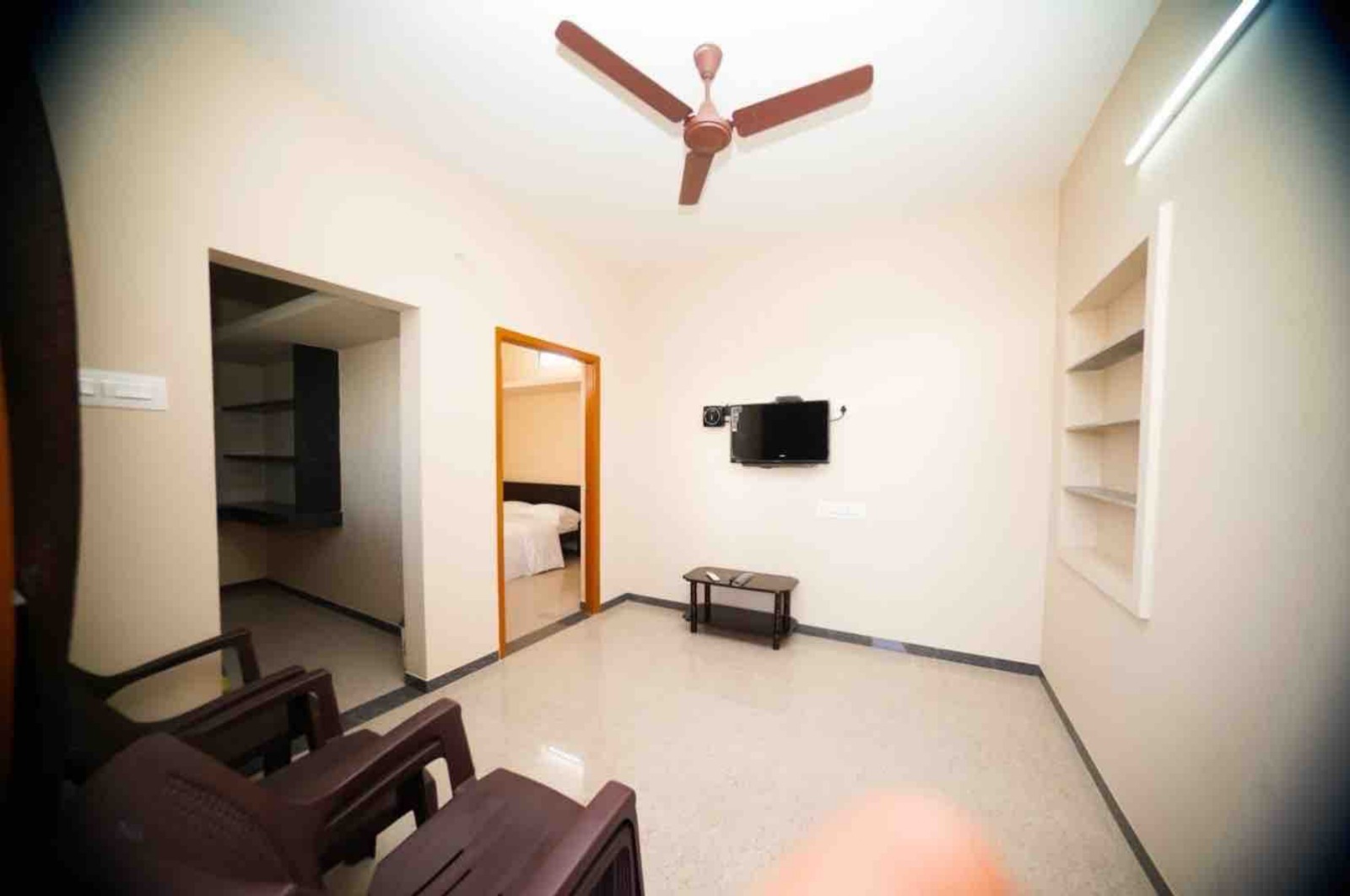 Spacious Living Hall with sofa seating and television
