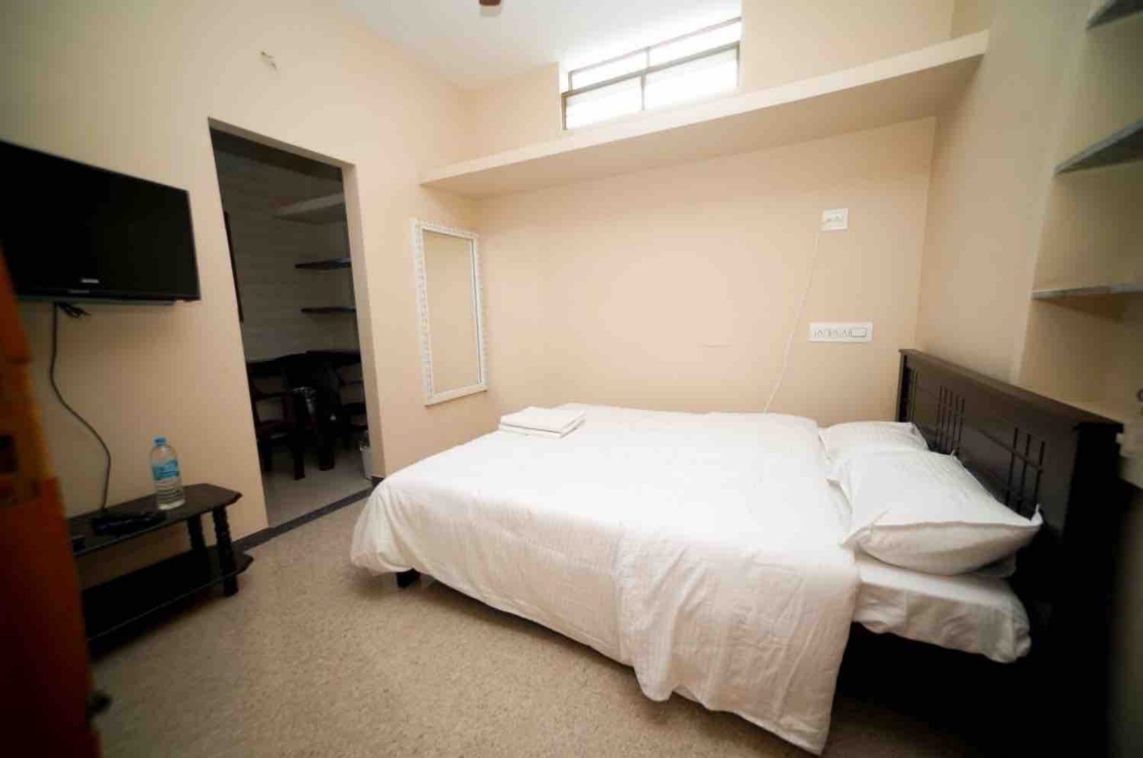 Master Bedroom Suite with wall mounted TV and dressing mirror